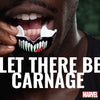 Person holding a mask with 'Let There Be Carnage' text and Marvel logo.