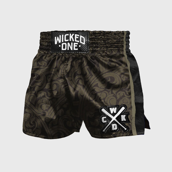 Black and green patterned boxing shorts with 'Wicked One' branding on a light gray background