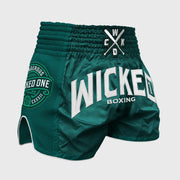 Green boxing shorts with 'Wicked One' branding on a gray background