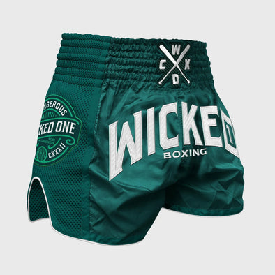 Green boxing shorts with 'Wicked One' branding on a gray background