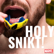 Person wearing a blue and yellow mouthguard with 'Marvel' branding, text overlay 'HOLY SNIKT!'