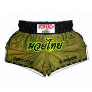 Green boxing shorts with black waistband featuring Yokkao branding on a white background