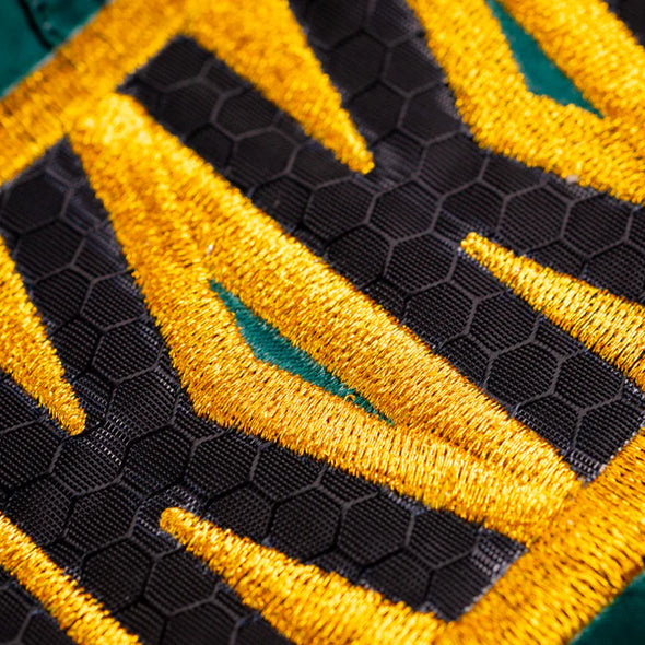 YOKKAO Original Muay Thai Shorts Gold Green with satin finish and high-cut design for mobility and style