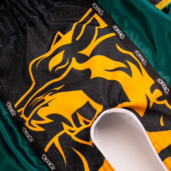 YOKKAO Original Muay Thai Shorts Gold Green with satin finish and high-cut design for mobility and style