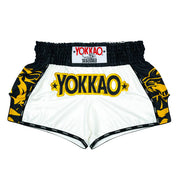YOKKAO Original Muay Thai Shorts Gold Green with satin finish and high-cut design for mobility and style