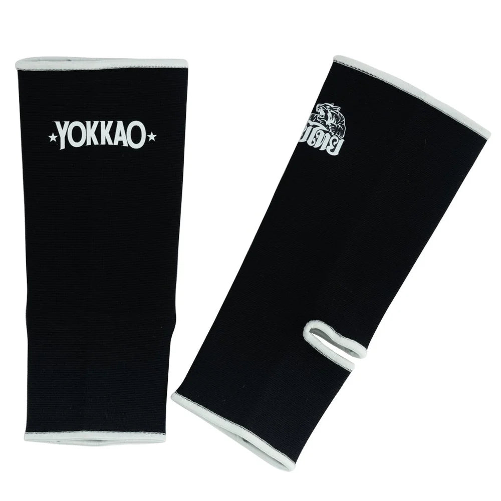 Black arm sleeves with Yokkao and King logos on a white background