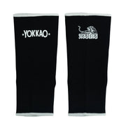 Black arm sleeves with Yokkao logo on a white background