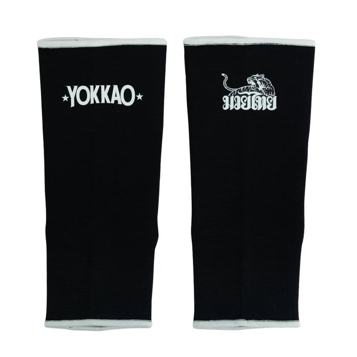 Black arm sleeves with Yokkao logo on a white background