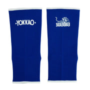 Pair of blue arm sleeves with Yokkao logo on a white background