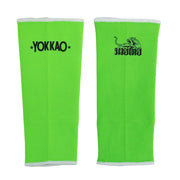 Pair of green athletic sleeves with Yokkao logo on a white background