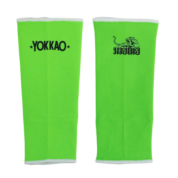 Pair of green athletic sleeves with Yokkao logo on a white background