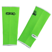 Green arm sleeves with YOKKAO branding on a white background