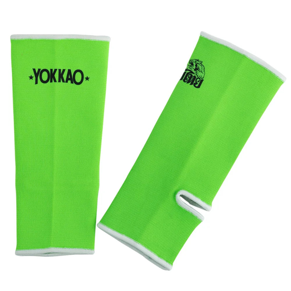 Green arm sleeves with YOKKAO branding on a white background