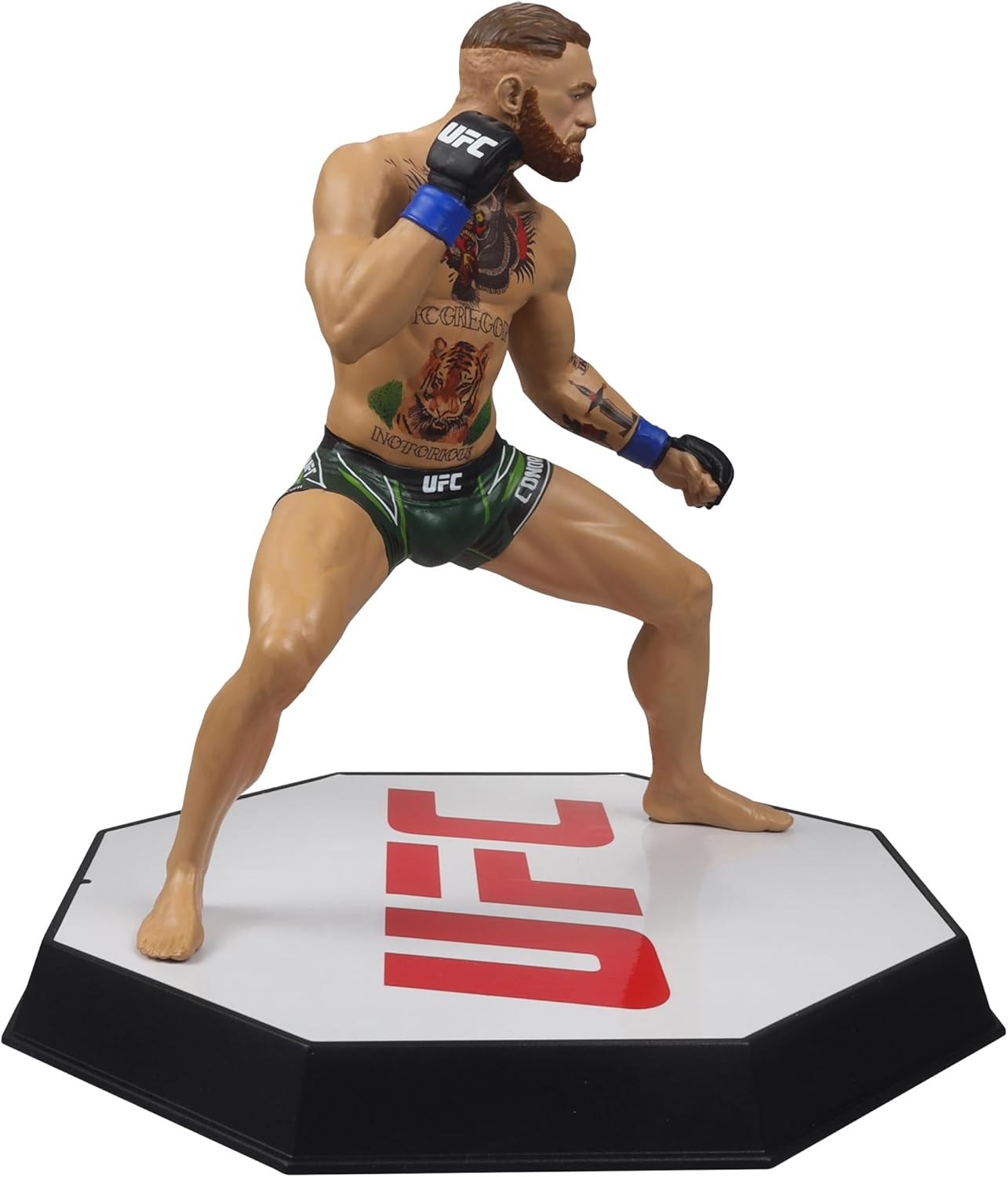 UFC fighter action figure on an octagon-shaped base with UFC branding