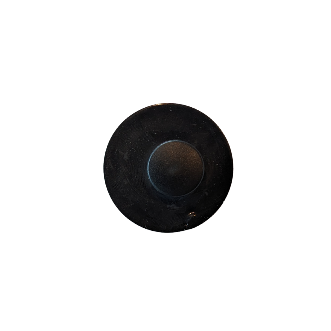 Black circular object on a white background