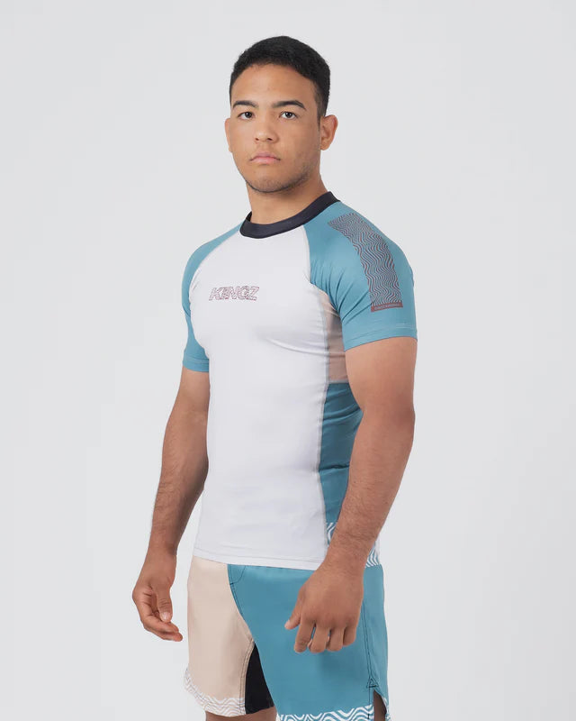 Person wearing a blue and white athletic outfit on a plain background