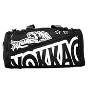 Black duffel bag with white tiger design and 'Yokkaco' branding on a white background