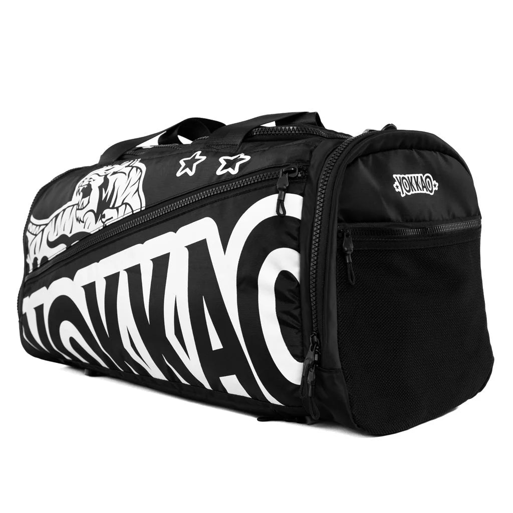 Black duffel bag with white branding on a white background