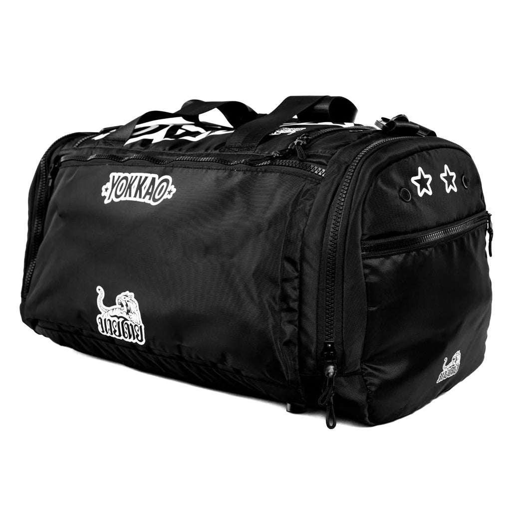 Black duffel bag with visible branding on a white background