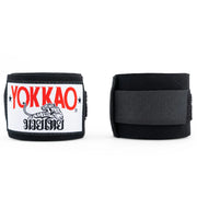 Black wrist wraps with Yokkao logo on a white background