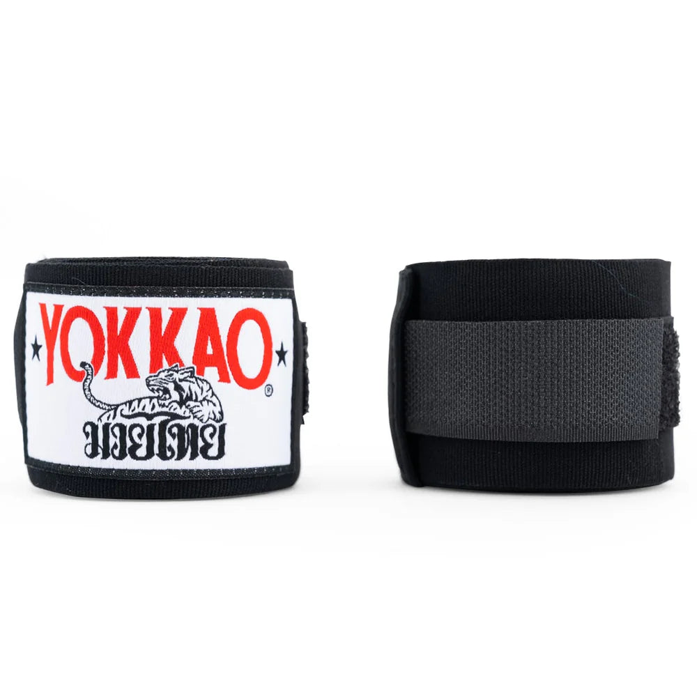 Black wrist wraps with Yokkao logo on a white background