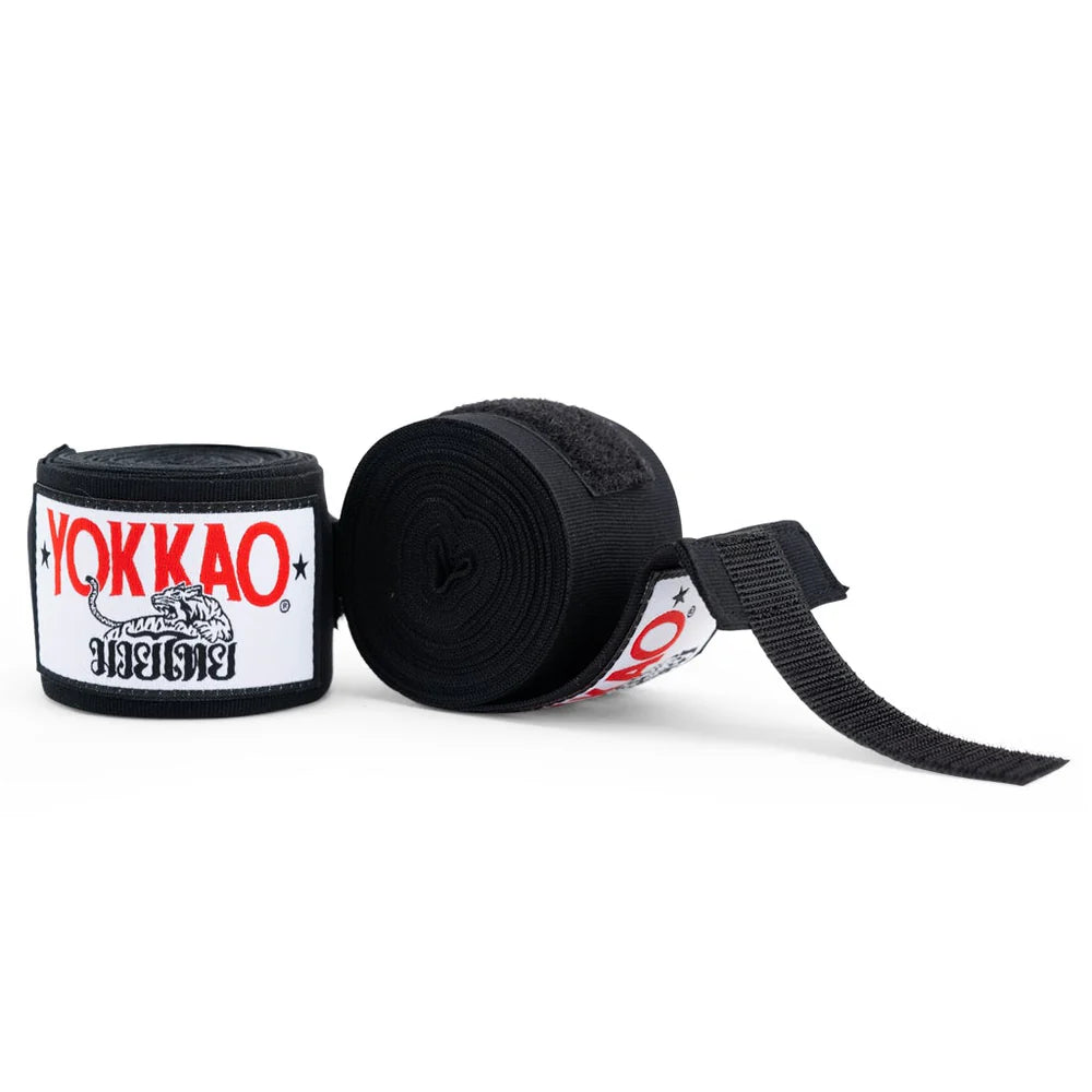 Black Yokkao boxing hand wraps on a white background