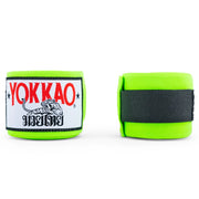 Green boxing hand wraps with Yokkao logo on a white background