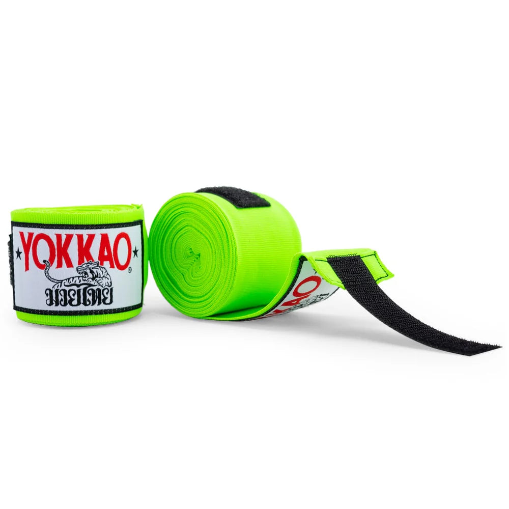 Green boxing hand wraps with Yokkao branding on a white background