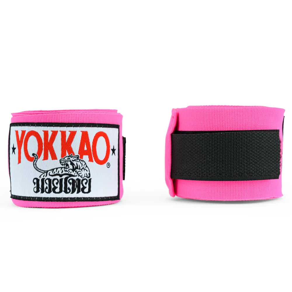 Pink wrist wraps with Yokkao logo on a white background