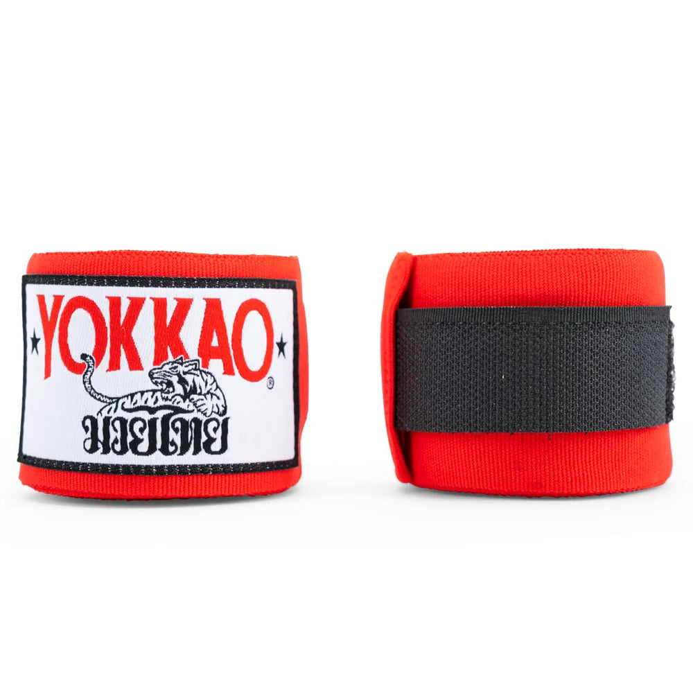 Red boxing hand wraps with Yokkao logo on a white background