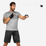 Man exercising with a resistance band on a white background