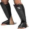 Black shin guards with a brand logo on a white background