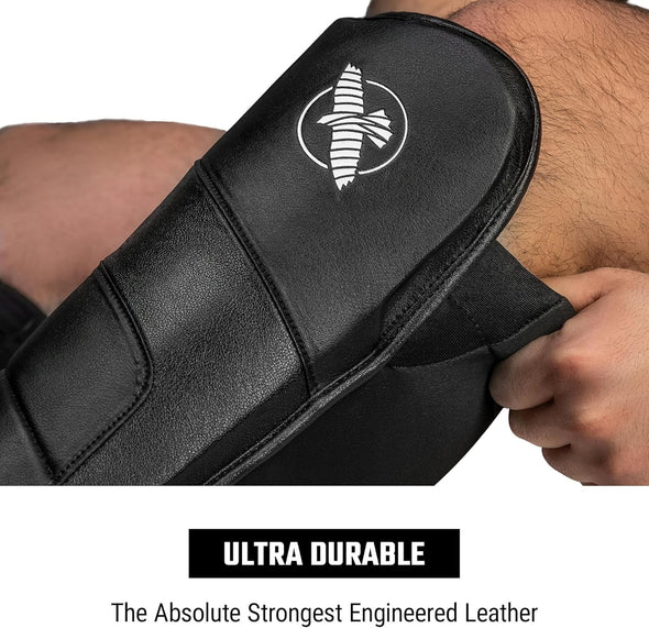 Black leather strap with a logo on a person's wrist, labeled 'Ultra Durable'.