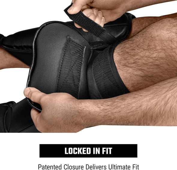 Person adjusting a black shin guard with text 'Locked in Fit' and 'Patented Closure Delivers Ultimate Fit'.