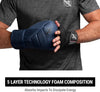 Person wearing a black glove with a brand logo, holding a blue glove, on a gray background.