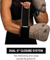 Person wearing boxing gloves with a focus on the dual-X closure system, featuring the brand 'Hayabusa'.