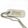 Metal dog tag with 'Fairtex F-Day' engraving on a white background