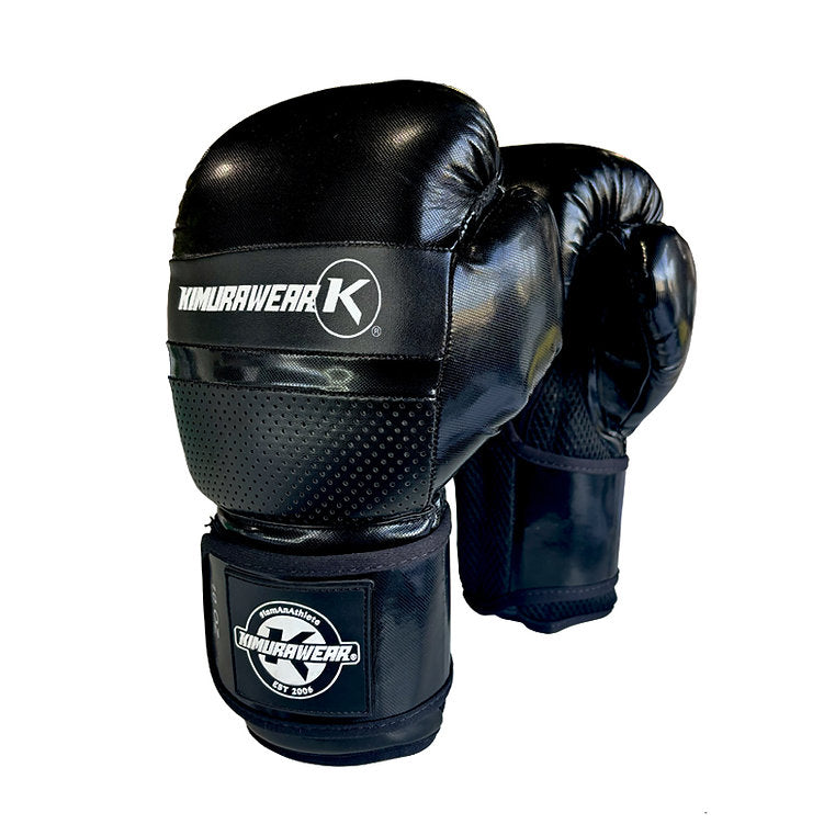 A pair of black boxing gloves with white 'KUMULAWEAR' branding on the wrist straps, shown against a plain white background.