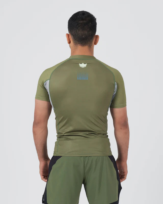 Person wearing a green athletic outfit on a white background