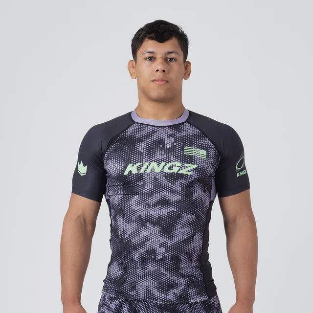 Person wearing a Kingz branded athletic outfit on a white background