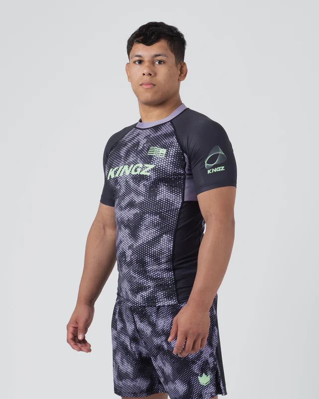 Person wearing a Kingz athletic outfit on a white background