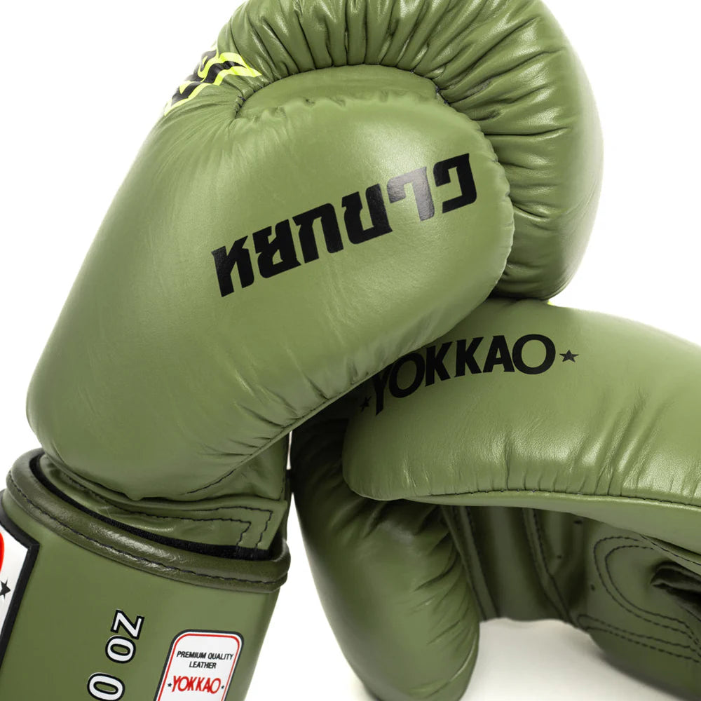 Green boxing gloves with 'Yokkao' branding on a white background
