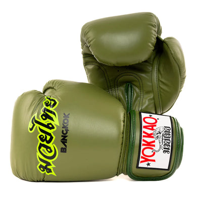 Pair of green boxing gloves with 'Yokkao' branding on a white background