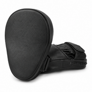 Black leather martial arts focus mitts shown from the back and side, featuring a textured leather surface and adjustable strap closure, on a white background.