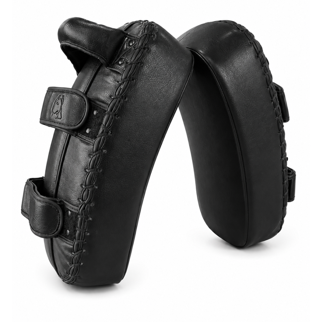 A pair of black leather boxing target pads with hook-and-loop strap closures, shown on a clean white background.