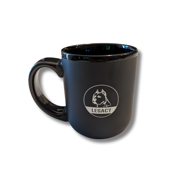 Legacy 16 oz ceramic mug in matte black with white Legacy dog-head logo, featuring large handle and satin finish for coffee, tea, or everyday drinks