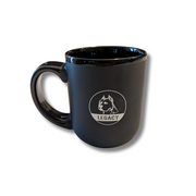 Legacy 16 oz ceramic mug in matte black with white Legacy dog-head logo, featuring large handle and satin finish for coffee, tea, or everyday drinks