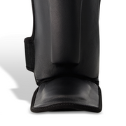 Legacy Golden Frank Leather Shin Guards featuring premium genuine leather construction, high-density foam padding, and a striking golden design for martial arts training.