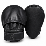 A pair of black leather boxing focus mitts shown on a clean white background, displaying both the front padded glove and the back flat side.