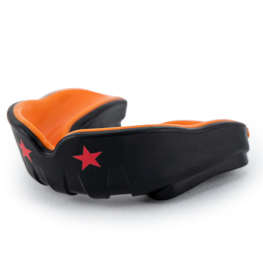 Black and orange mouthguard with red stars on a white background